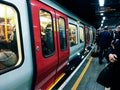 Crowd of people at Victoria Underground station platform during busy hours Royalty Free Stock Photo