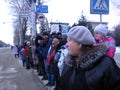 A crowd of people waiting in Novosibirsk, a motorcade of important officials