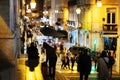 Crowd of people walking down a street at night - city life Royalty Free Stock Photo