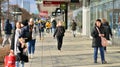 Warsaw, Poland. 8 March 2023. Crowd of people walking down an urban sidewalk Royalty Free Stock Photo