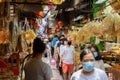 Crowd of people walking shopping for Chinese food resource in Chinatown Yaowarach market and waring face mask for protect Royalty Free Stock Photo