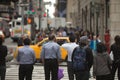 Crowd of people walking on street sidewalk Royalty Free Stock Photo