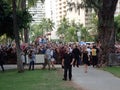 Crowd of people watch and photograph stars walking the red carpet during the Hawaii 5-0 Television show season 5 premier