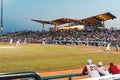 a crowd of people watching baseball from a field with fans