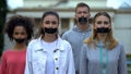 Crowd performance with taped mouth, violation of speech freedom, censorship