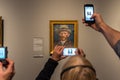 Crowd photographing Vincent Van Gogh self-portrait in Amsterdam