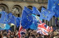 A crowd of protesters waving flags at the leeds for europe anti brexit demonstration