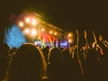 Crowd raising their hands and enjoying great festival party or concert.