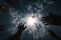 Crowd reaching for bright light through dramatic cloudy sky, concept of hope, despair, salvation, or divine help Royalty Free Stock Photo