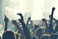 Crowd rocking during a concert with raised arms. Royalty Free Stock Photo