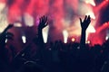 Crowd rocking during a concert with raised arms. Royalty Free Stock Photo