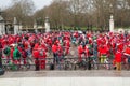 Crowd of Santa cyclists by Buckingham Palace. London