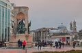 Crowd at the secular Republic Monument at Taksim Square, Beyoglu district Istanbul Turkey with Hagia Triada Greek Orthodox Church Royalty Free Stock Photo