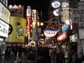Crowd of shoppers in street at night in Osaka shopping center, Japan. Royalty Free Stock Photo