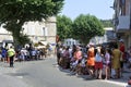 The crowd of supporters in the streets of Anduze spreading the passage of the caravan of the Tour de France