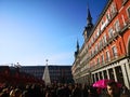 Crowd surrounding the white Christmas tree in Plaza Mayor, main square, Madrid, Spain