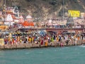 Crowd taking bath in Ganges & performing rituals at Ganga Ghat Royalty Free Stock Photo