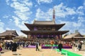 Crowd taking photos of Japanese Buddhist monks in the countyard of zojoji temple.