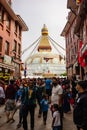 Crowd of Tibetan Buddhist worshipers at Boudhanath temple complex in Kathmandu Nepal