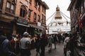 Crowd of Tibetan Buddhist worshipers at Boudhanath temple complex in Kathmandu Nepal