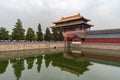 Crowd of Tourist People with umbrellas at the entrance of the famous Forbidden palace city in Beijing, China