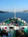 A crowd of tourists on the bow of a ferry taking pictures of the views. Traveling by ferry. Sea transport