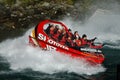 Crowd tourists experiencing a jet boat in the Shotover River Queenstown New Zealand