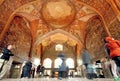 Crowd of tourists inside the historical hall with fresco of palace Chehel Sotoun in Isfahan.