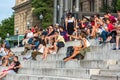 Crowd of tourists sit on the National Palace stairs in Barcelona Royalty Free Stock Photo