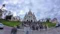 Crowd of tourists walking near Sacre Coeur Basilica in spring day timelapse Paris, France Royalty Free Stock Photo