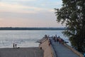 A crowd of vacationers on the Volga beach on a summer evening, Samara, August 2021, background