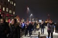 Crowd walking in snow during a light show