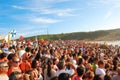 Crowd Watching Boat Race in Portugal with Mountains and Ocean in Background