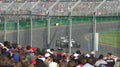 Crowd watching F1 car racing in the Australian Grand Prix at Albert Park circuit, F1 Aus GP, Melbourne