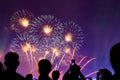 Crowd watching fireworks and celebrating city founded. Beautiful colorful fireworks display in the urban for celebration on dark