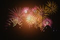 Crowd watching fireworks and celebration. Happy family sitting on floor and watching the fireworks Celebration at night on New Royalty Free Stock Photo