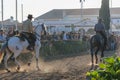 Crowd watching two men riding the horses at the National Horse Fair 2022 in Golega