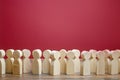 A crowd of wooden figures of people. Society, demography. Customers and buyers, statistics, preferences of Population. group