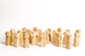 A crowd of wooden figures of people on a white background. Human resource, search for candidates for work. Social survey Royalty Free Stock Photo