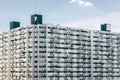 Crowded apartment tower in modern downtown city metro poor crowd people home living in high density building lifestyle Royalty Free Stock Photo