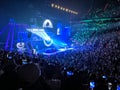 A crowded arena and concert scene