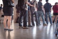 Crowded Asian commuters queuing at train station in Singapore