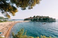 Crowded beach near the isthmus opposite the island of Sveti Stefan. Montenegro