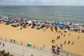 A crowded beach with people resting