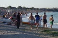 People walking or tanning on beach