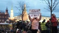 Protester with placard banner stands in defense of Alexey Navalny on rally.