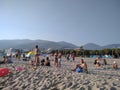 The crowded Cleopatra beach with mountain views