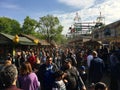 Crowded Fun Fair / Carnival with Roller Coaster in sunny spring weather Kirmes in NeukÃÂ¶lln / Kreuzberg