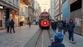 Crowded Istiklal street in istanbul with lots of stores and famous red tram. 15th of March, 2023, Turkey, Istanbul