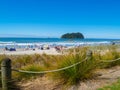 Crowded Mount Maunganui main beach on summer day